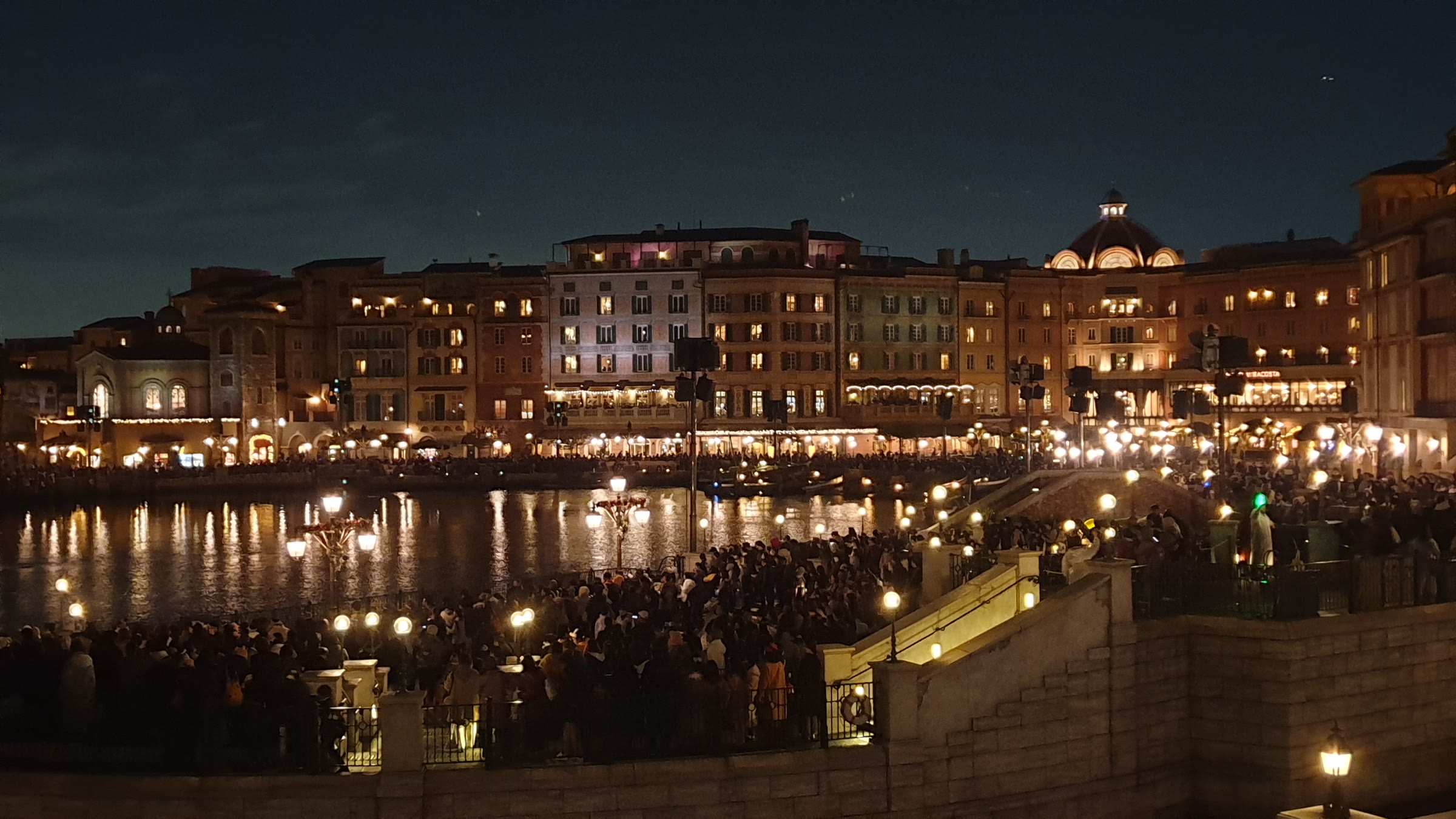 Mediterranean Harbor at Tokyo DisneySea at night, with Hotel MiraCosta and the open water